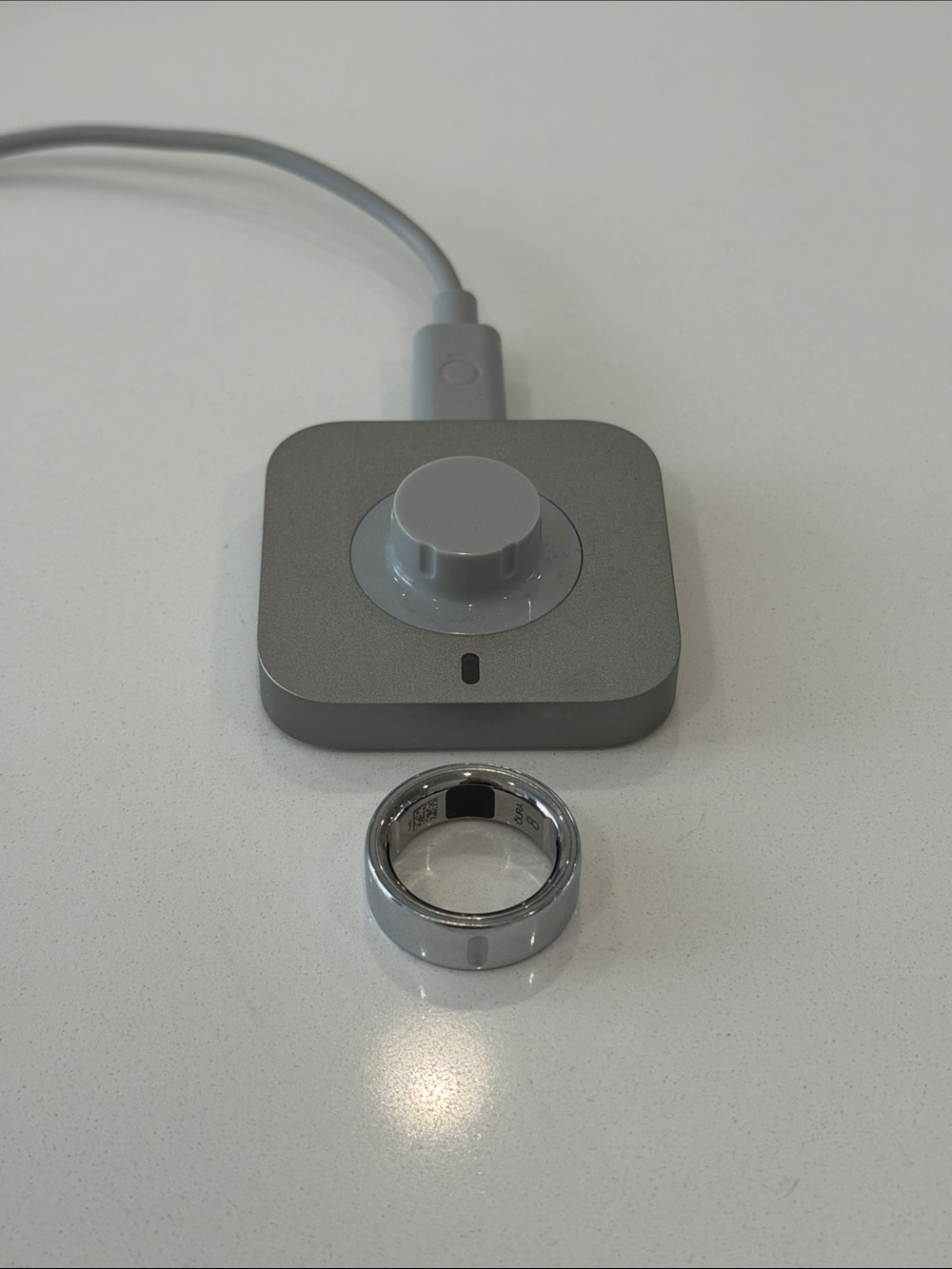 Oura Silver Smart Ring with Gray Charger Dock